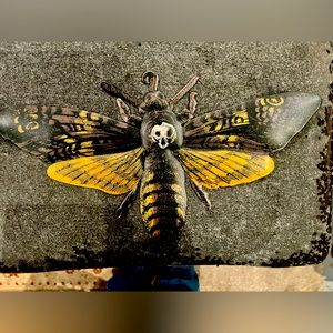 Metal death moth wall decor